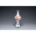 A Chinese revolving 'dragon' vase on celadon stand, Qianlong mark, 20th C.