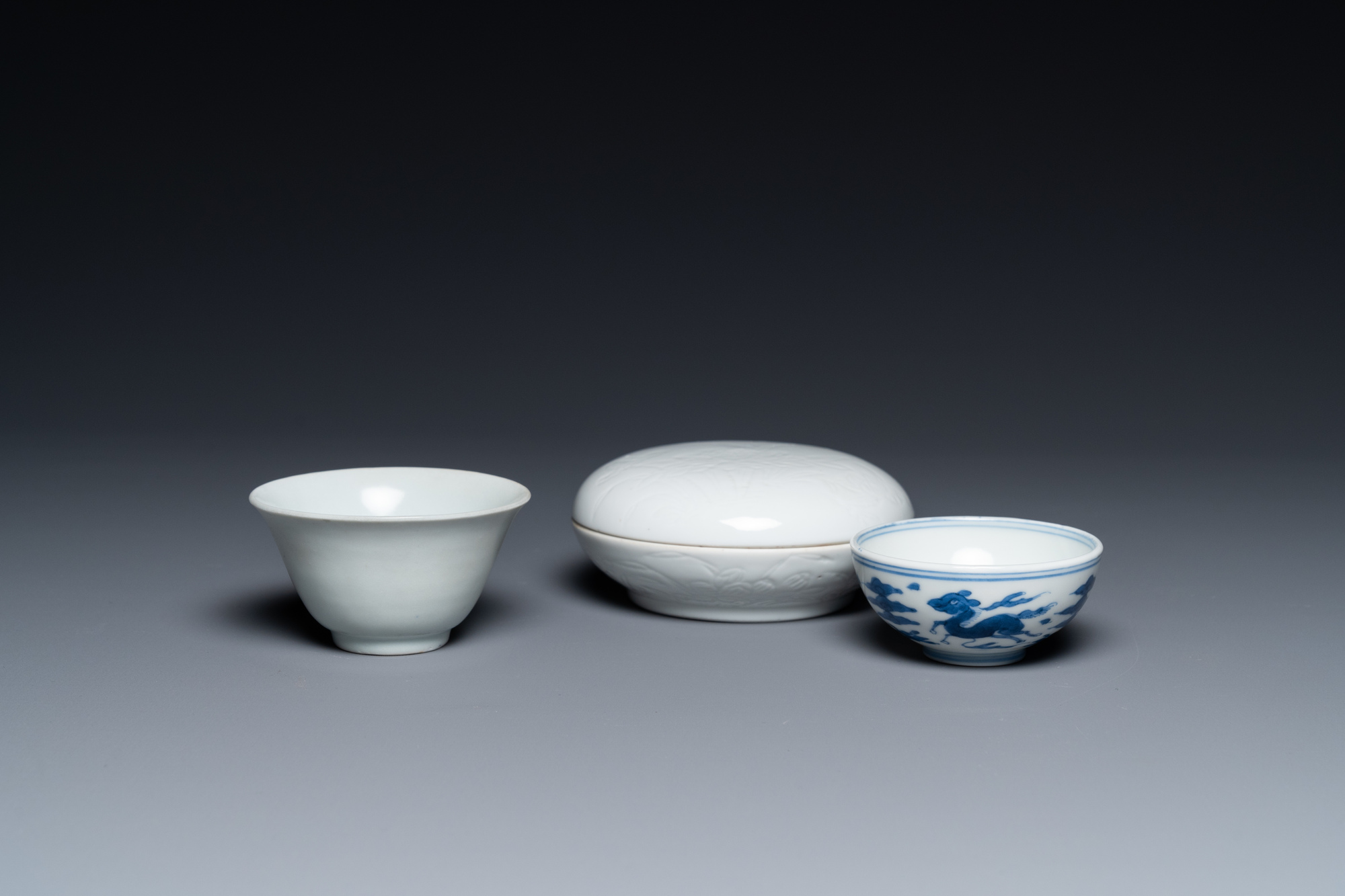 A Chinese white-glazed bowl, a small blue and white bowl and a covered box with incised design, Ming - Image 2 of 8