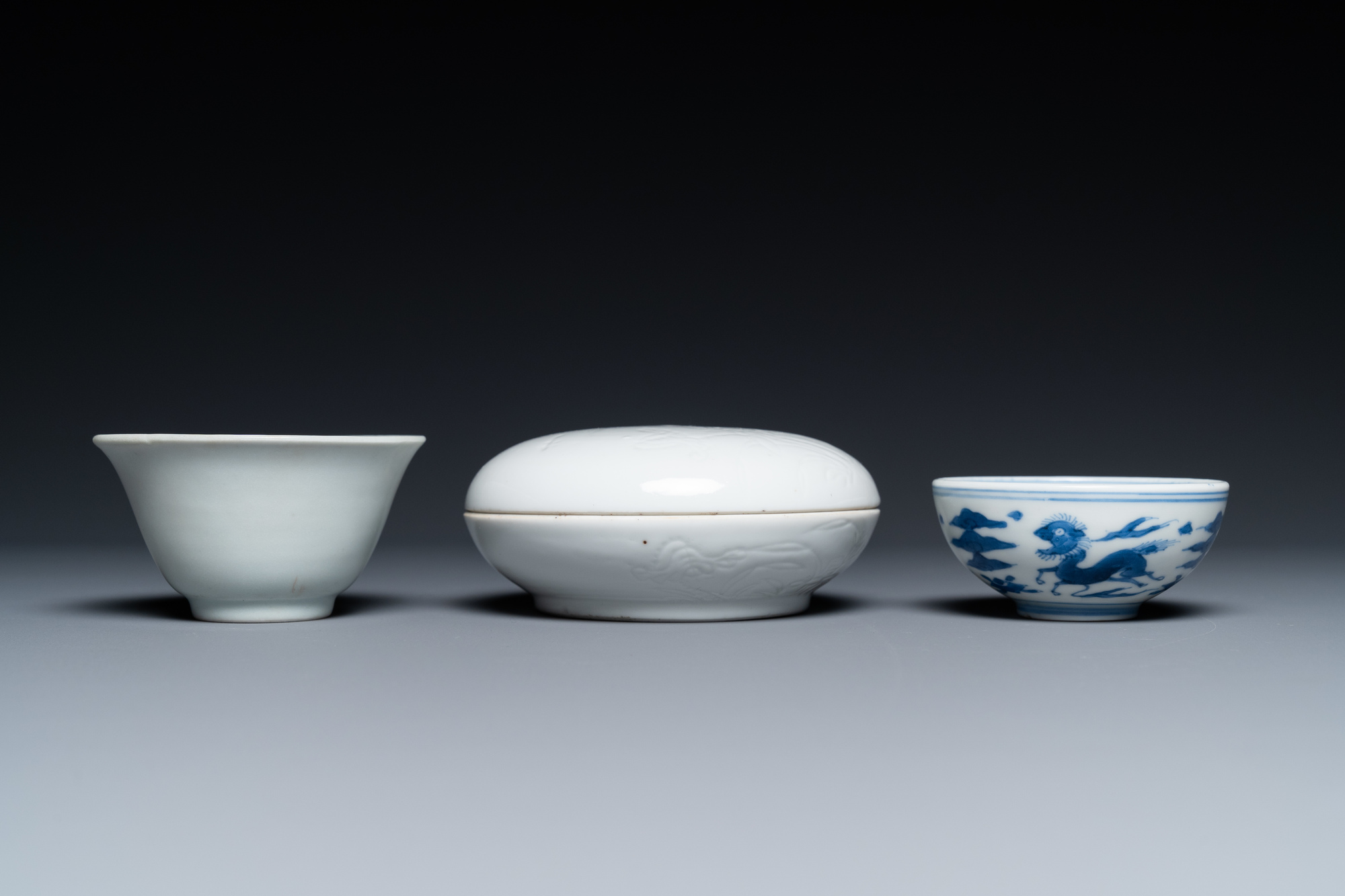 A Chinese white-glazed bowl, a small blue and white bowl and a covered box with incised design, Ming - Image 6 of 8