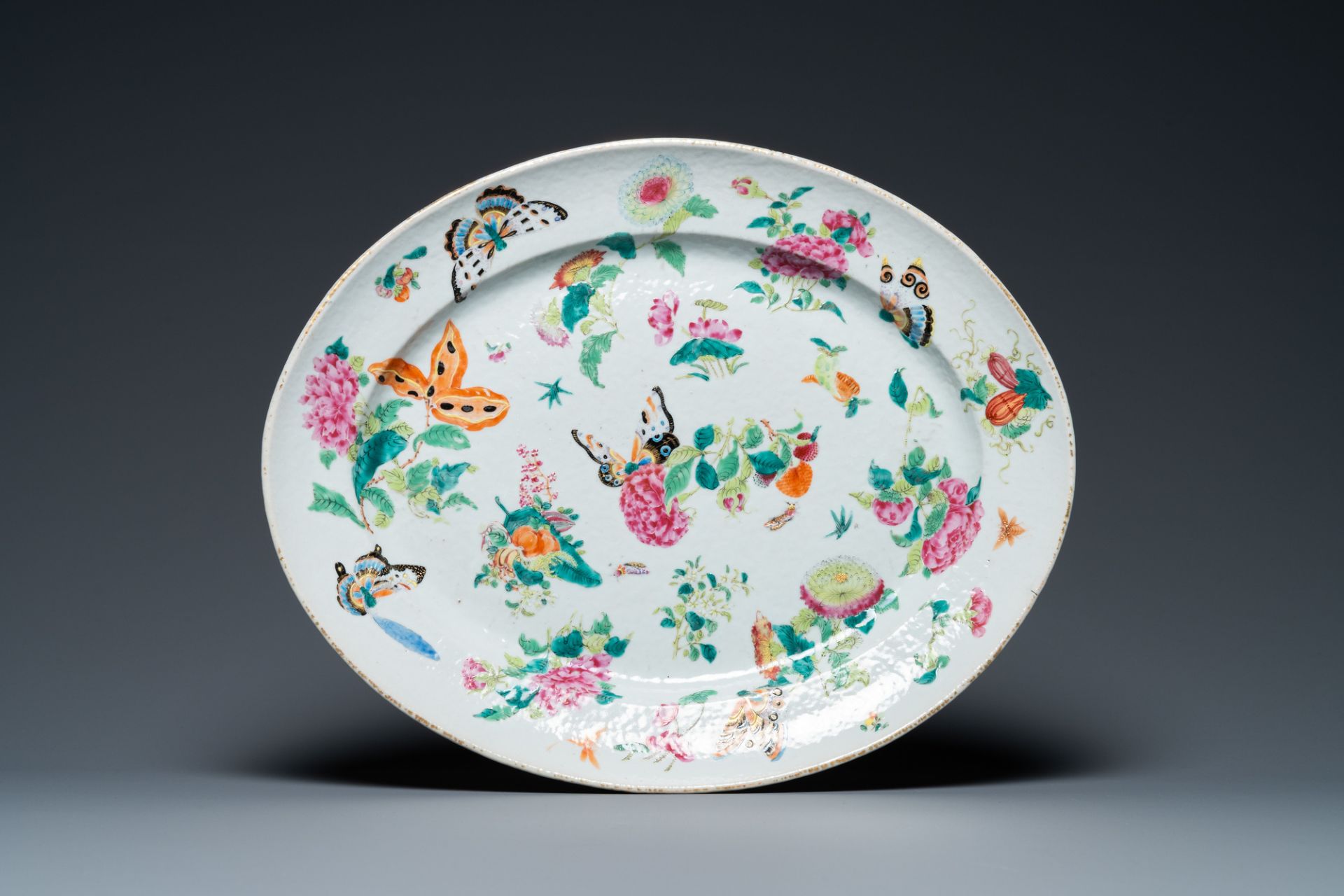 A Chinese Canton famille rose 'butterflies' tureen and cover on stand, 19th C. - Image 2 of 9