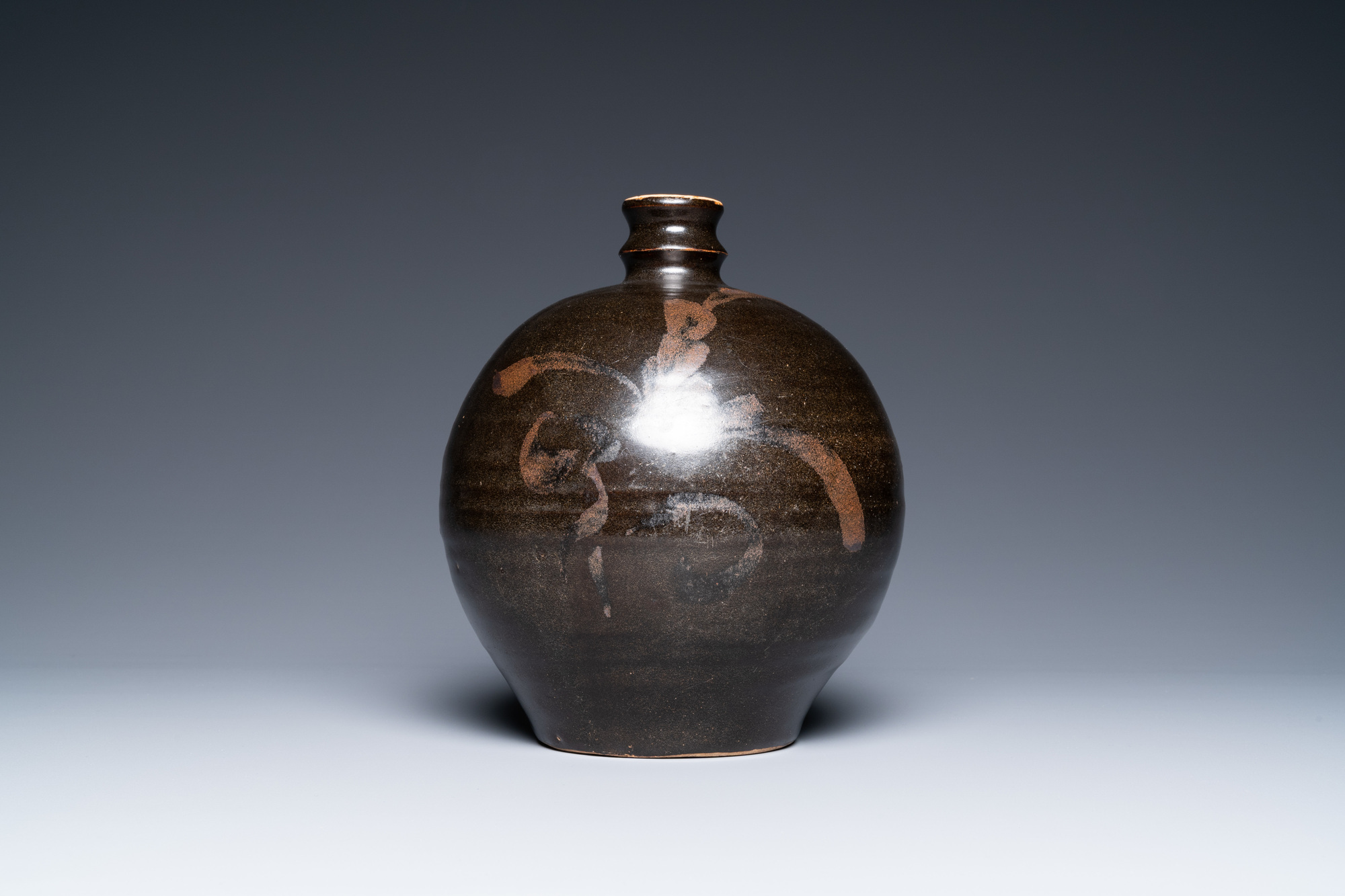 A Chinese black-brown-glazed russet-splashed jar, Henan kilns, Song