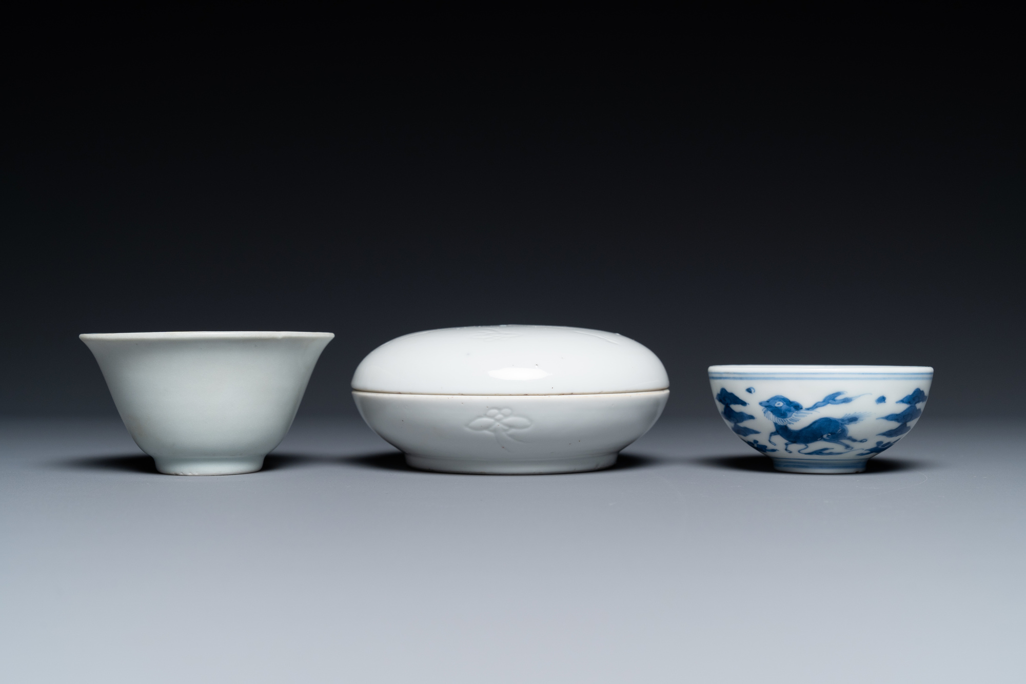 A Chinese white-glazed bowl, a small blue and white bowl and a covered box with incised design, Ming - Image 5 of 8