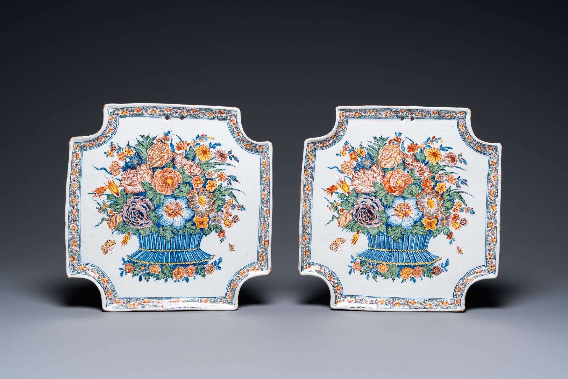 A pair of exceptionally fine polychrome Dutch Delft flower basket plaques, 18th C.