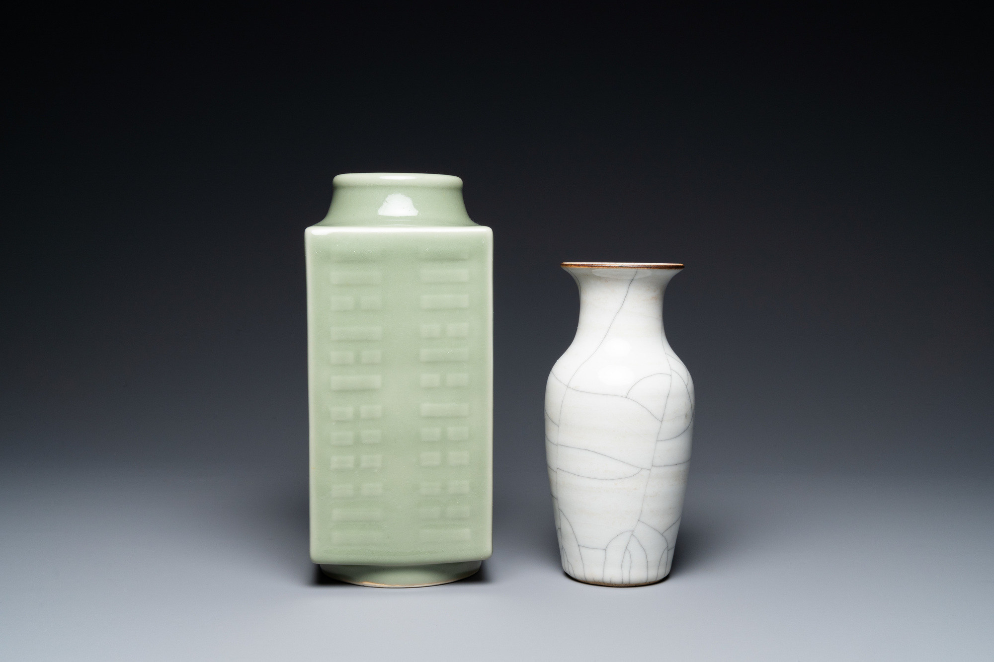 A Chinese celadon 'cong' vase with trigrams and a crackle-glazed vase, 19/20th C. - Image 5 of 7