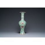 A Chinese verte biscuit 'peony scroll' vase, Ming