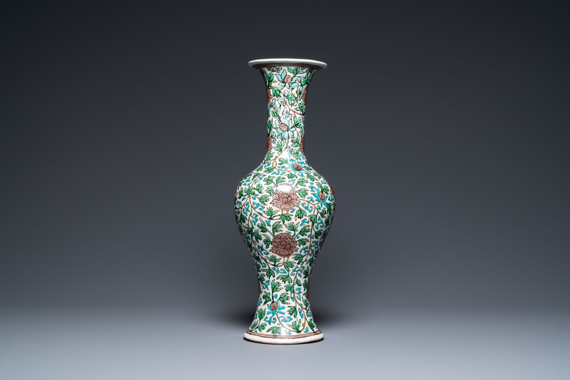 A Chinese verte biscuit 'peony scroll' vase, Ming