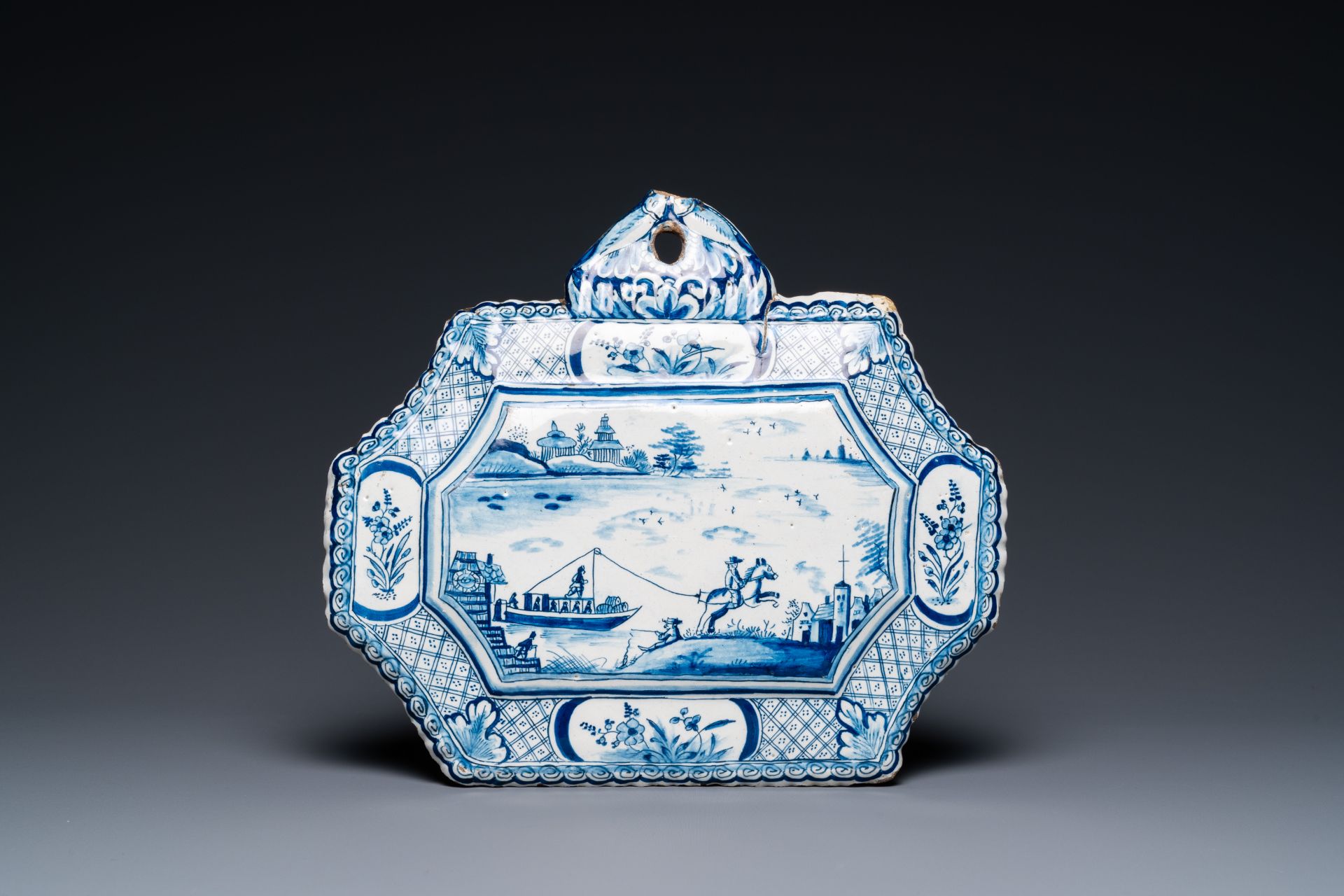 A Dutch Delft blue and white plaque depicting a horse-drawn boat, 18th C.