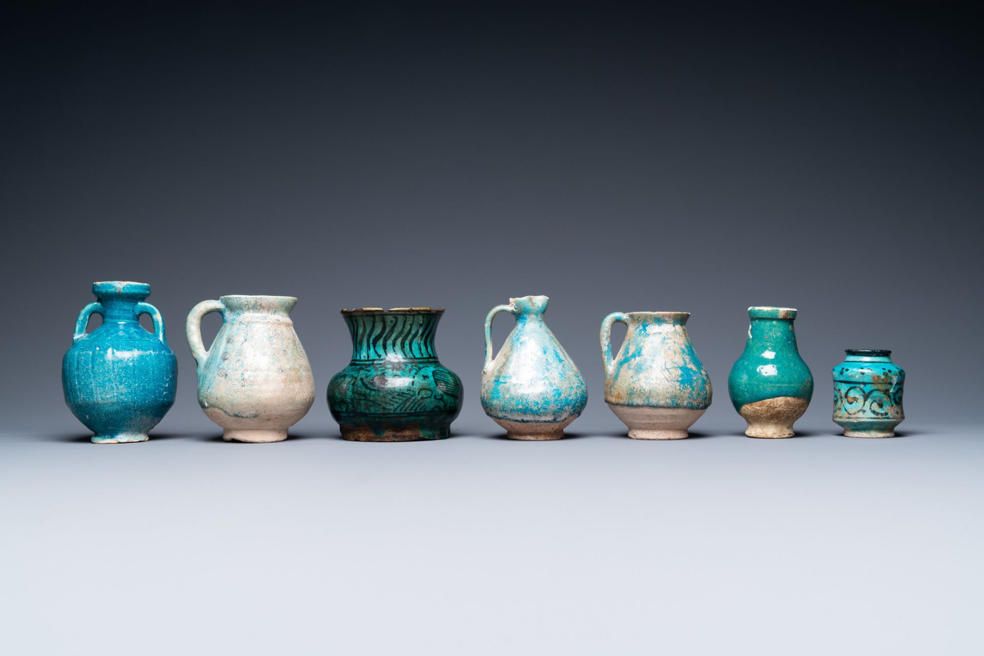 A collection of seven turquoise-glazed jugs and vases, Middle-East, 13th C. and later - Image 4 of 7