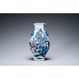 A Chinese blue, white and copper-red 'mountainous landscape' vase, 19th C.