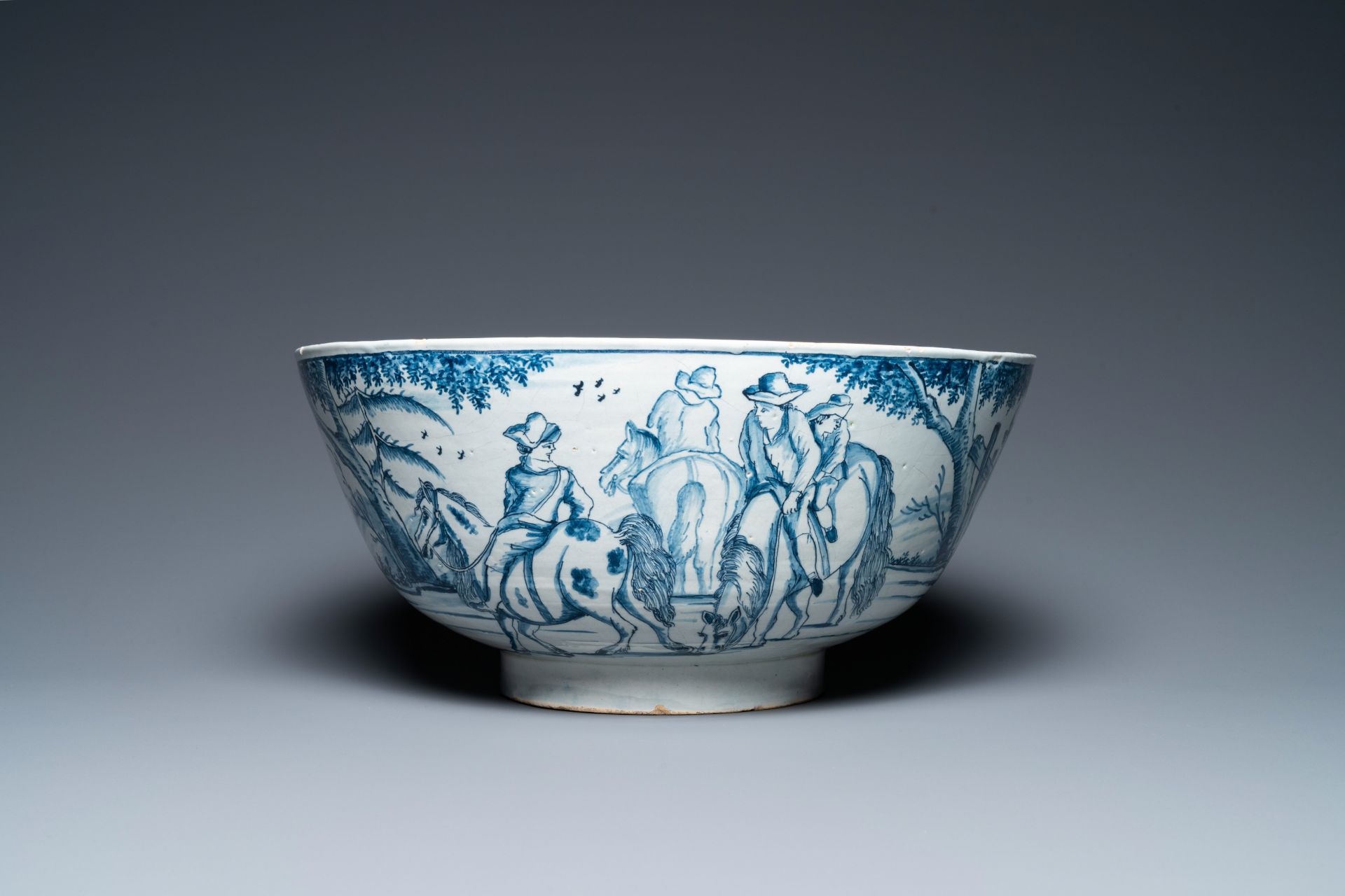 A large Dutch Delft blue and white bowl with shepherds on horsebacks, 18th C. - Image 2 of 9