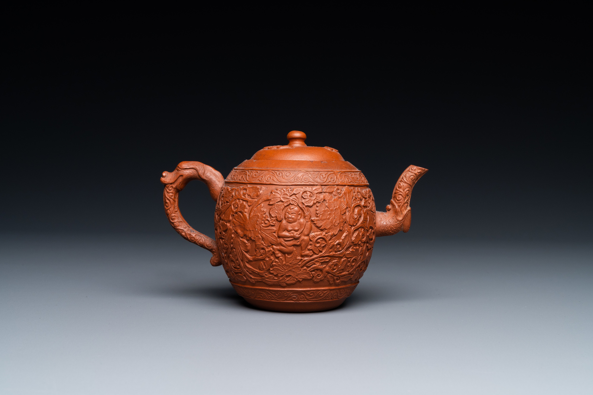 A Chinese Yixing stoneware teapot with boys among peony scrolls, Kangxi - Image 4 of 23