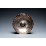 A Persian silver bowl with raised center, 8/12th C.