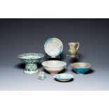 Two turquoise- and black-glazed dishes, three bowls, a jug and a small lion, Raqqa and Nishapur, Mid