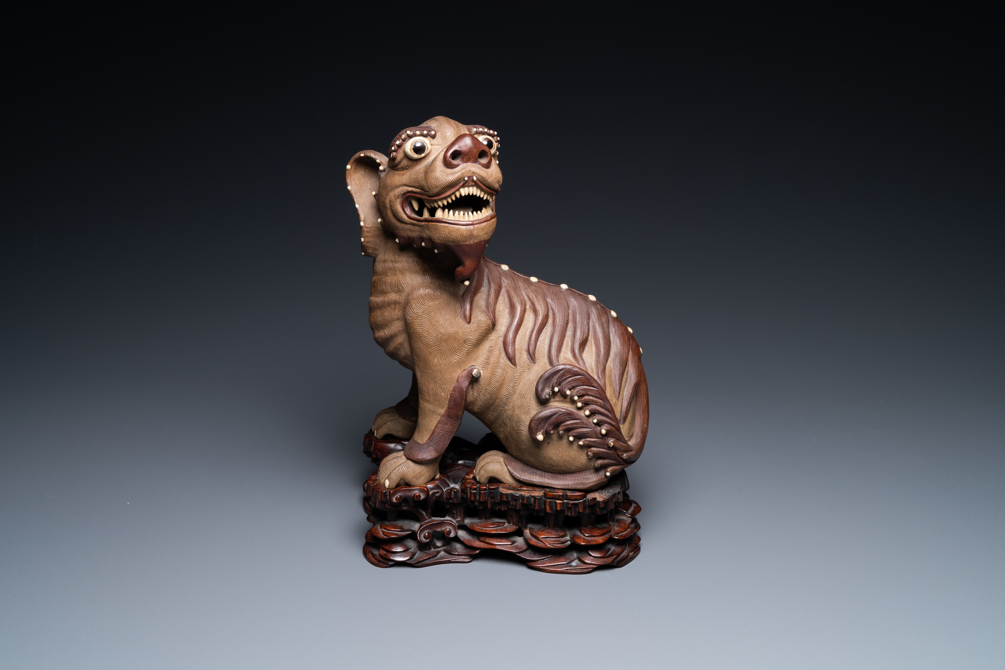 A Chinese Yixing stoneware dog on wooden stand, 19th C - Image 2 of 8