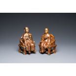 A pair of Chinese partly gilded seated figures, Zeng Long Sheng Zao mark, 20th C.
