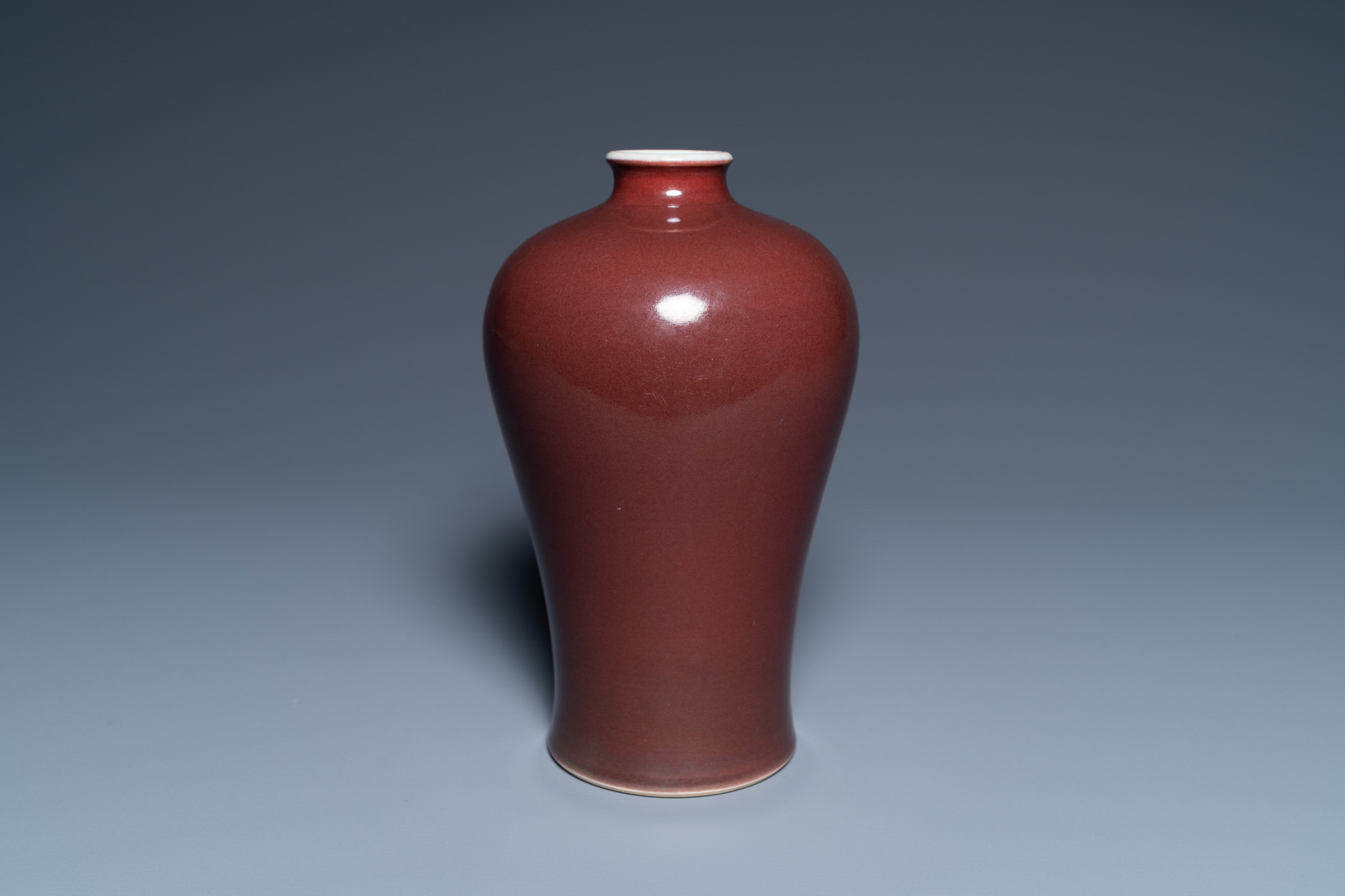 A Chinese monochrome dark copper red meiping vase, Qianlong mark and of the period