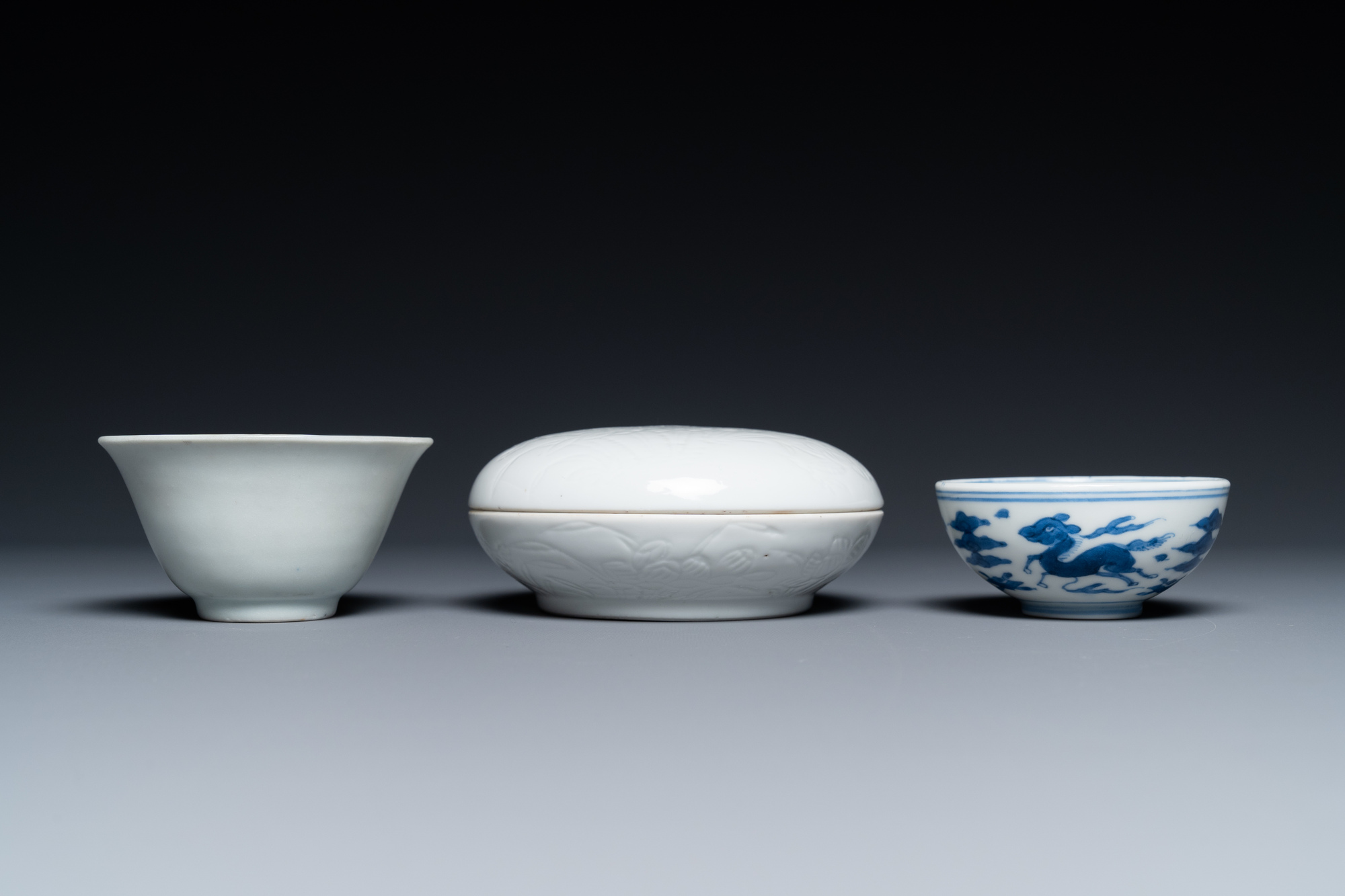 A Chinese white-glazed bowl, a small blue and white bowl and a covered box with incised design, Ming - Image 3 of 8