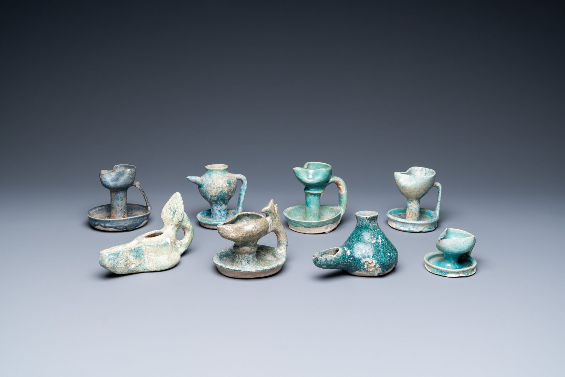 Eight turquoise-glazed oil lamps, Middle-East, 13th C. and later