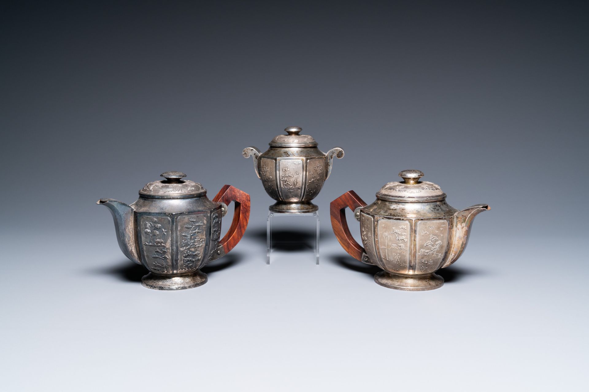 Two Vietnamese silver teapots and a sugar bowl and cover, marked Donghung, ca. 1900