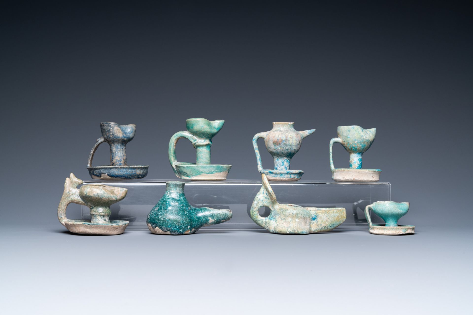 Eight turquoise-glazed oil lamps, Middle-East, 13th C. and later - Image 4 of 7