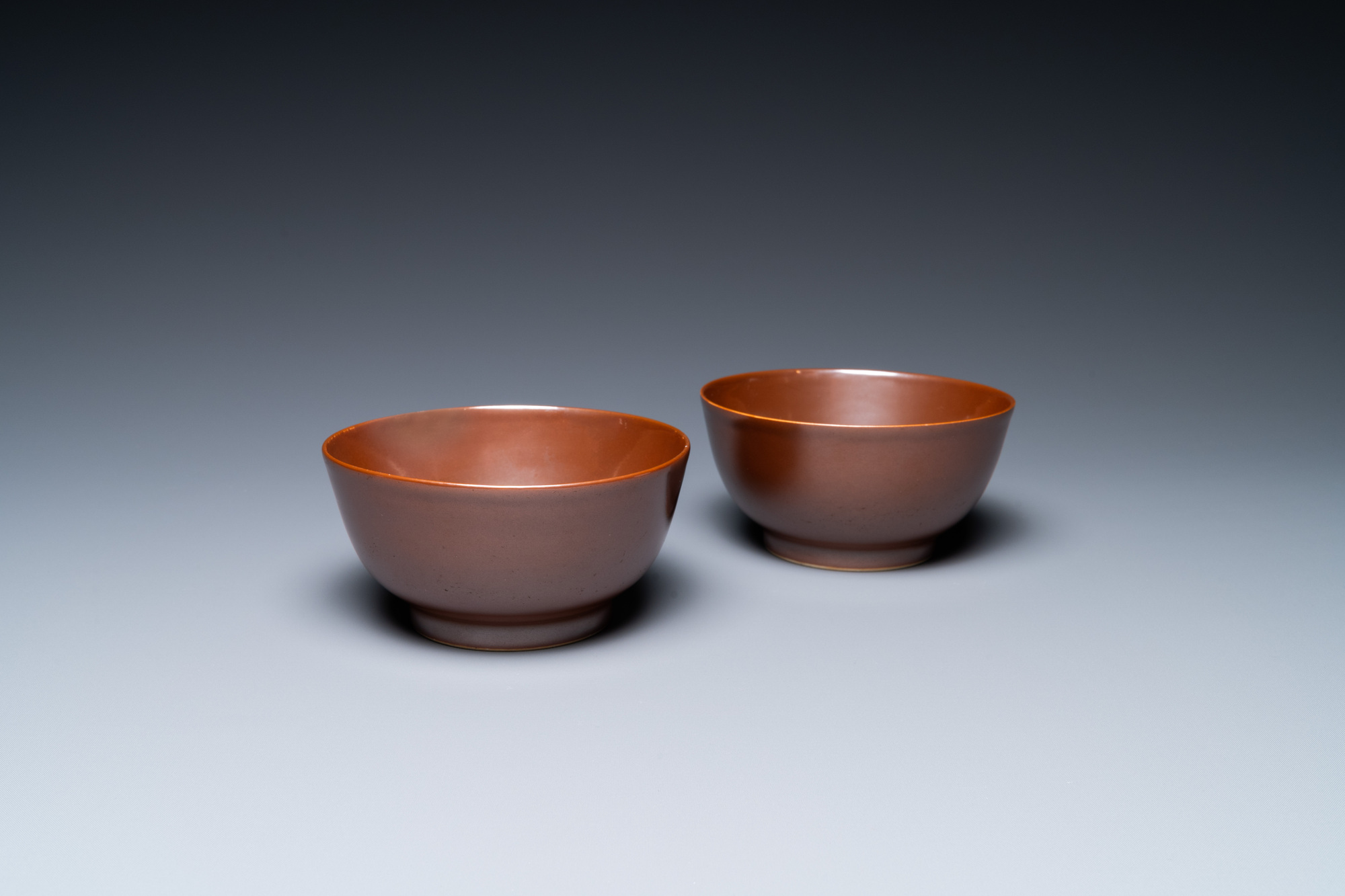 A pair of Chinese cafe au lait-glazed bowls, Qianlong mark and of the period