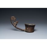 A Vietnamese bronze ladle depicting a musician, Dong Son, ca. 5th/2nd C. BC