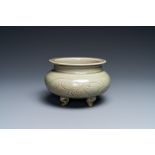 A Chinese Yaozhou celadon tripod censer, Song or later