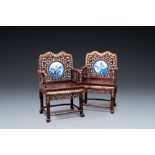 A pair of Chinese mother-of-pearl-inlaid wooden chairs with blue and white porcelain plaques, 19th C