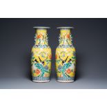 A pair of Chinese yellow-ground famille rose vases, 19th C.