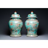 A pair of large Chinese turquoise-ground famille verte vases and covers, 19th C.