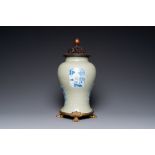 A Chinese celadon-glazed 'lotus scroll' vase with blue, white and copper-red panels, Kangxi