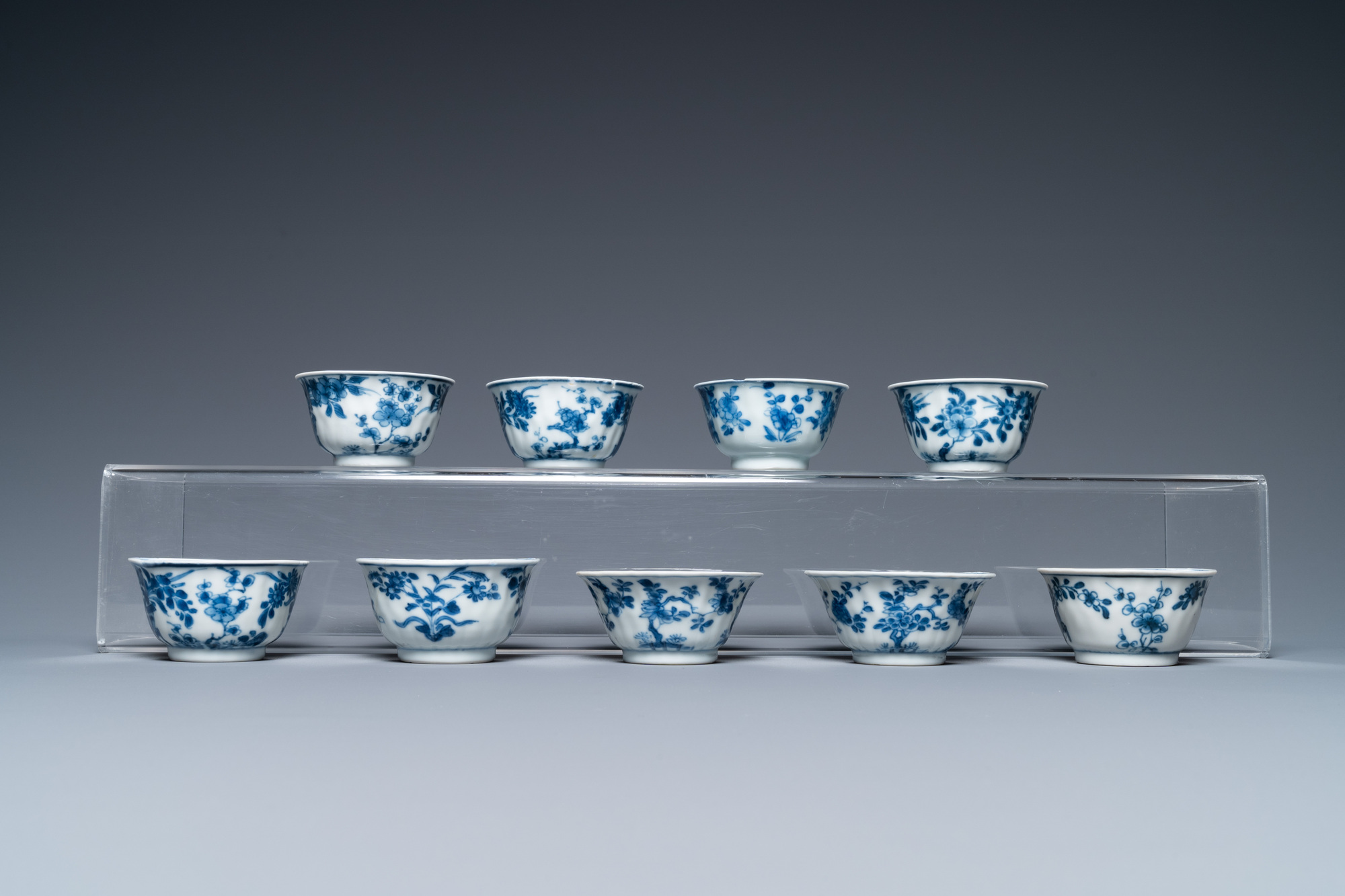 Ten Chinese blue and white saucers and nine cups, Kangxi - Image 5 of 11