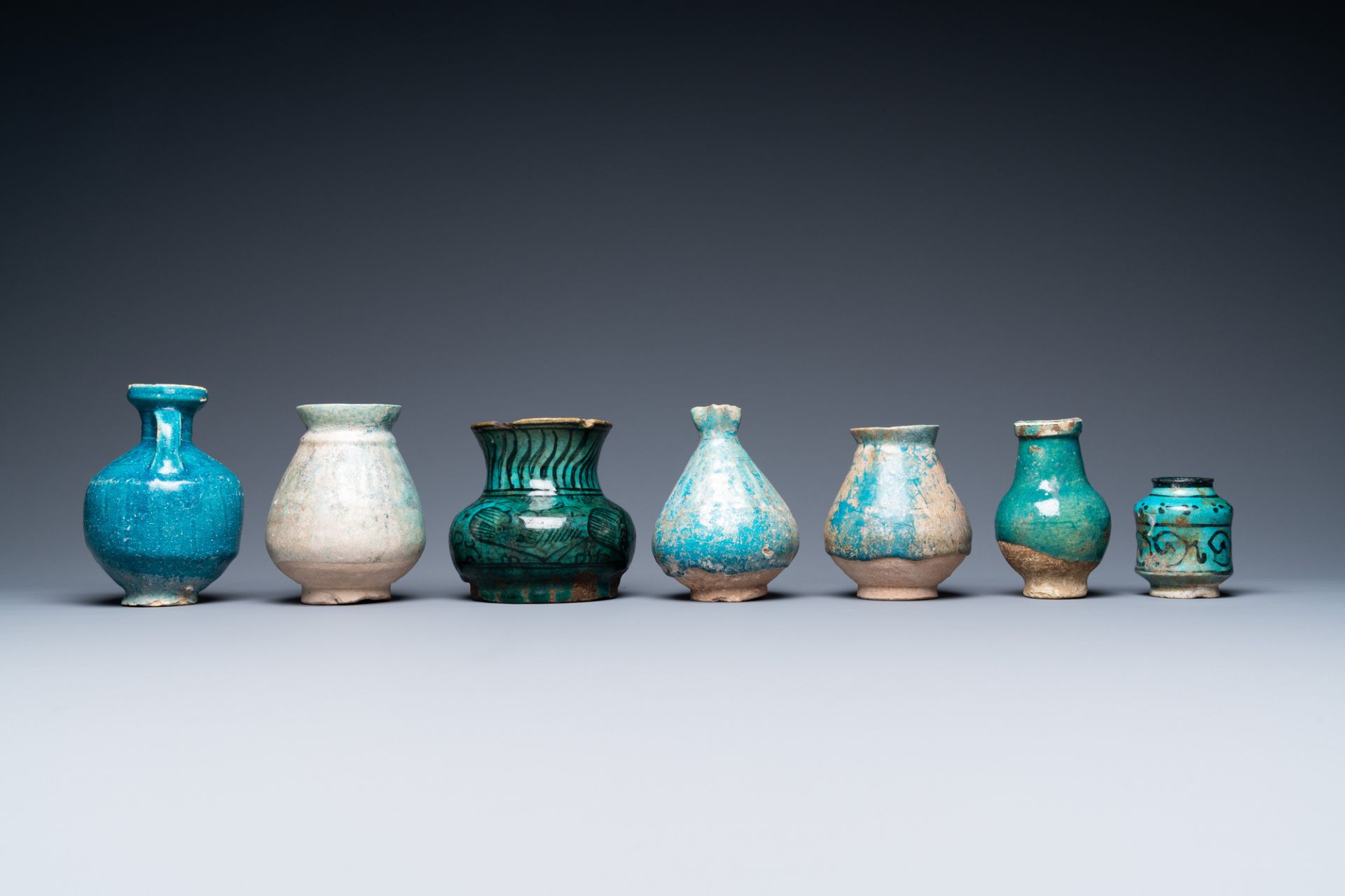 A collection of seven turquoise-glazed jugs and vases, Middle-East, 13th C. and later - Image 3 of 7