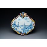 A Dutch Delft blue and white mixed technique landscape plaque, 18th C.