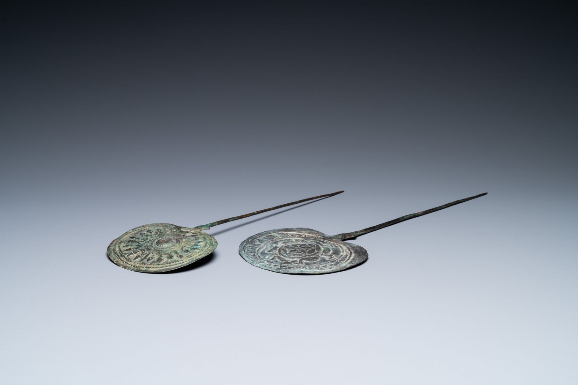 Two large Luristan bronze disc-headed clothing pins, Iran, 1st millenium BC