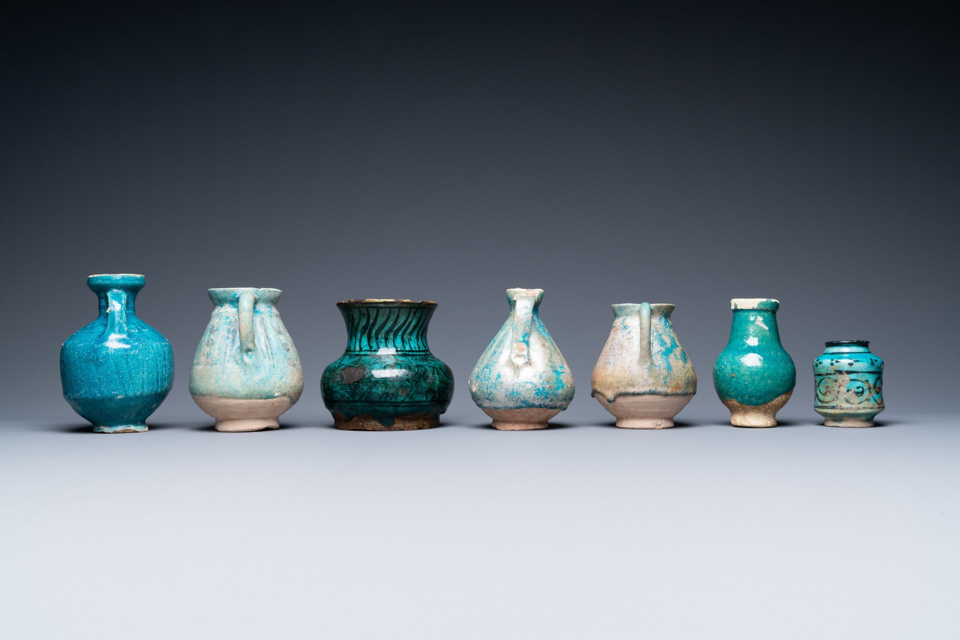 A collection of seven turquoise-glazed jugs and vases, Middle-East, 13th C. and later - Image 5 of 7