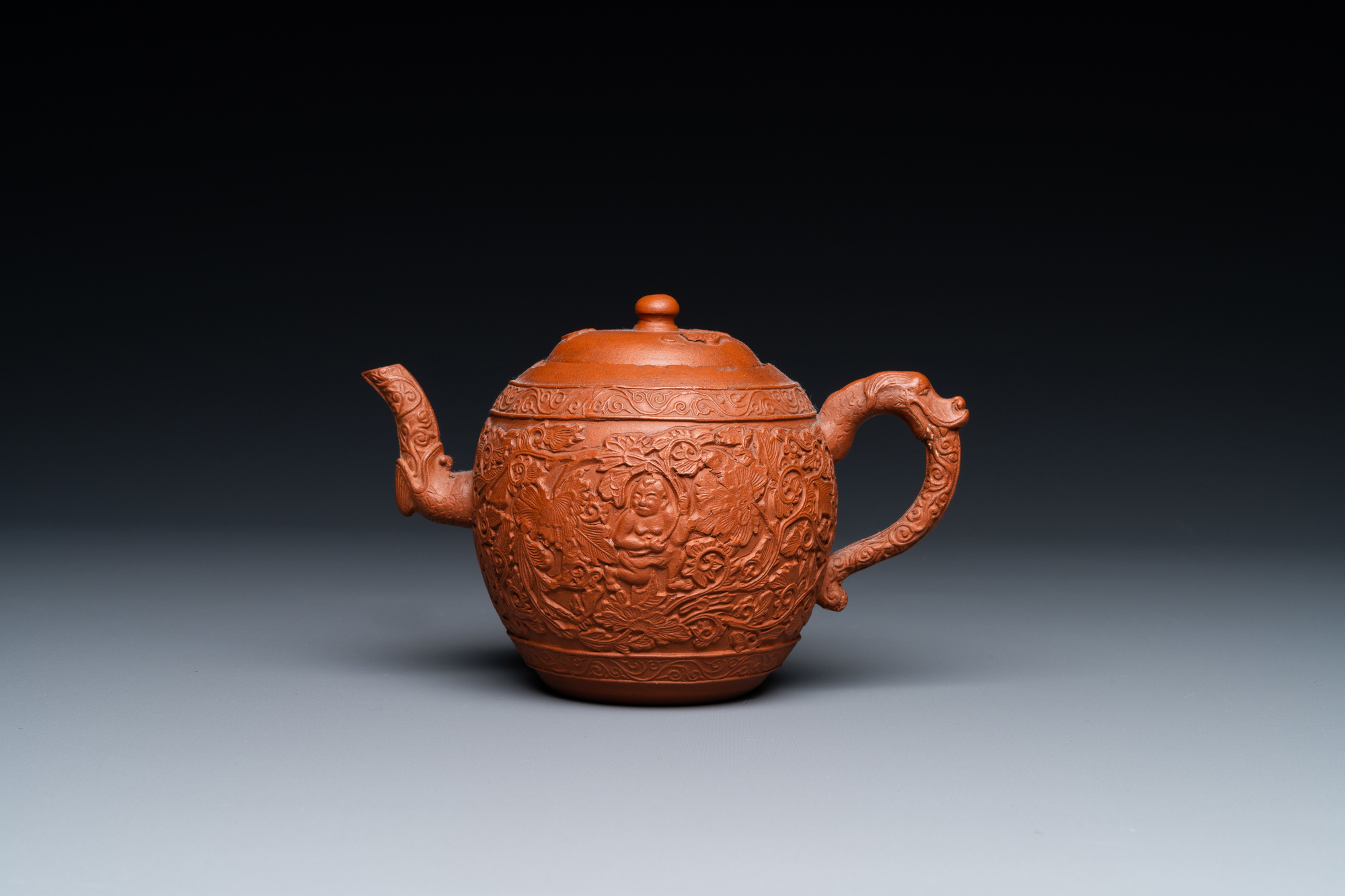 A Chinese Yixing stoneware teapot with boys among peony scrolls, Kangxi - Image 2 of 23