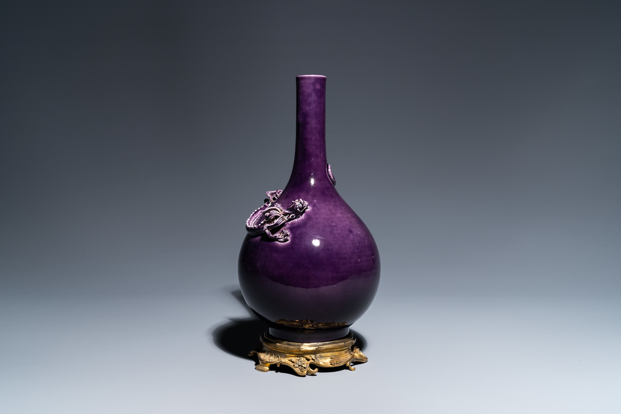 A Chinese monochrome aubergine-glazed bottle vase with gilt bronze mounts, Qianlong mark, 19/20th C. - Image 2 of 11