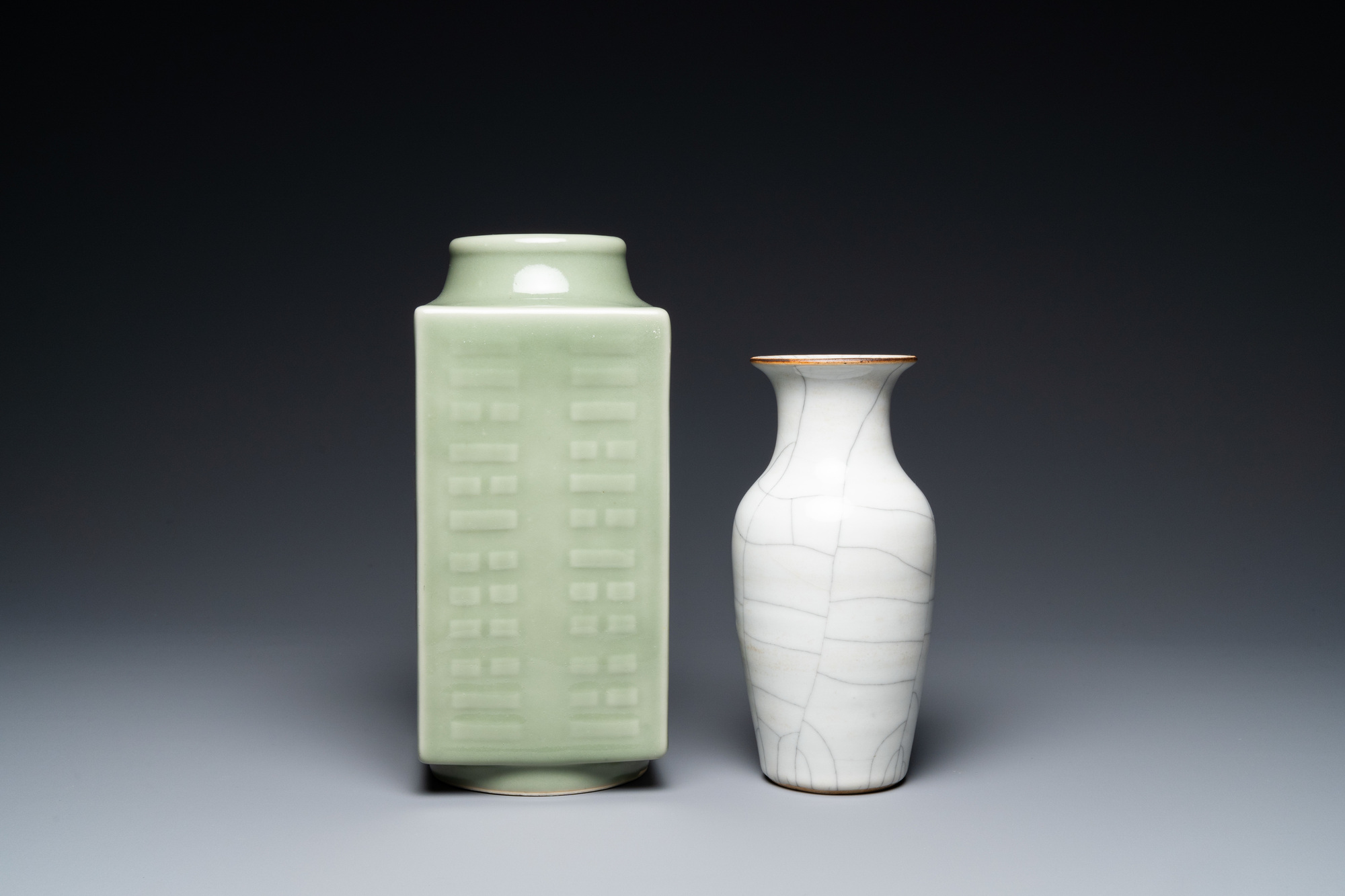 A Chinese celadon 'cong' vase with trigrams and a crackle-glazed vase, 19/20th C. - Image 4 of 7