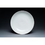 A Chinese monochrome white dish with incised double phoenix design, Jiajing mark, Ming