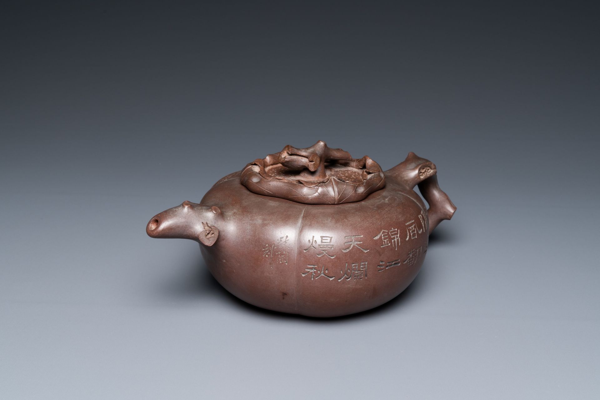 A Chinese melon-shaped Yixing stoneware teapot, signed Qi Tao (Wu Hanwen) and dated 1923