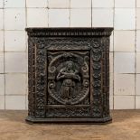 A small dark-patinated wooden corner cabinet with a shepherdess, 17th C. and later