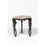 An hexagonal African colonial parquetry side table on elephant legs, 20th C.