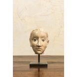 An Italian marble head in Roman style with coins inlaid as eyes, probably 17th C.