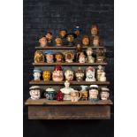 A collection of barbotine tobacco jars in the shape of heads of men and animals, 19/20th C.