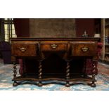 An English walnut sideboard with three drawers, 19th C.