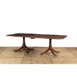 A large English mahogany dining table, 19th C.