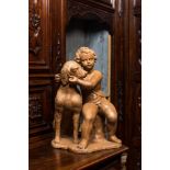 A terracotta group with a putto near a dog, 19th C.