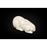 A white crackle-glazed faience Art Deco model of a hare or rabbit, Ch. Lemanceau for Saint-Clement,