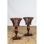 A pair of English Regency-style mahogany plant stands, 19th C.